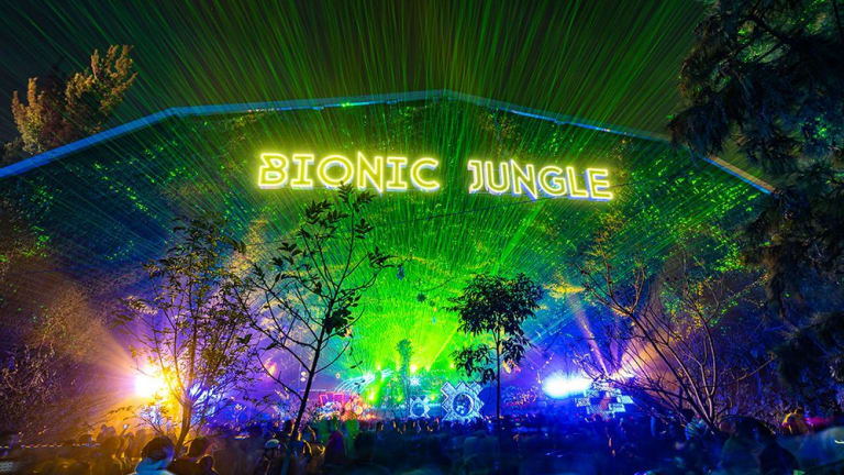 Jungle vibes at Bionic Jungle with lasers and crowd of people