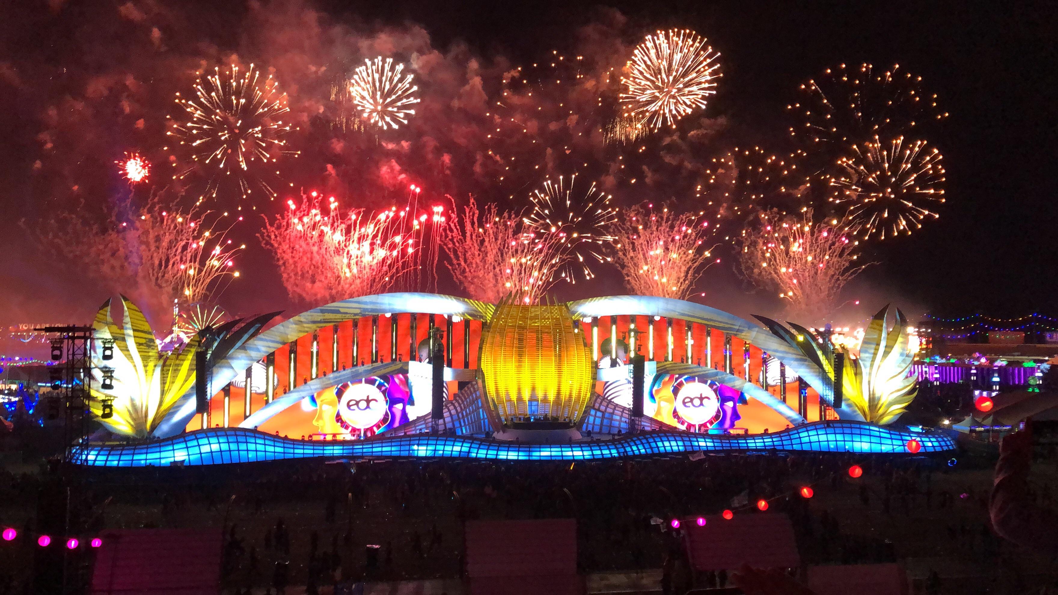 Cosmic Meadow stage with fireworks going off behind it