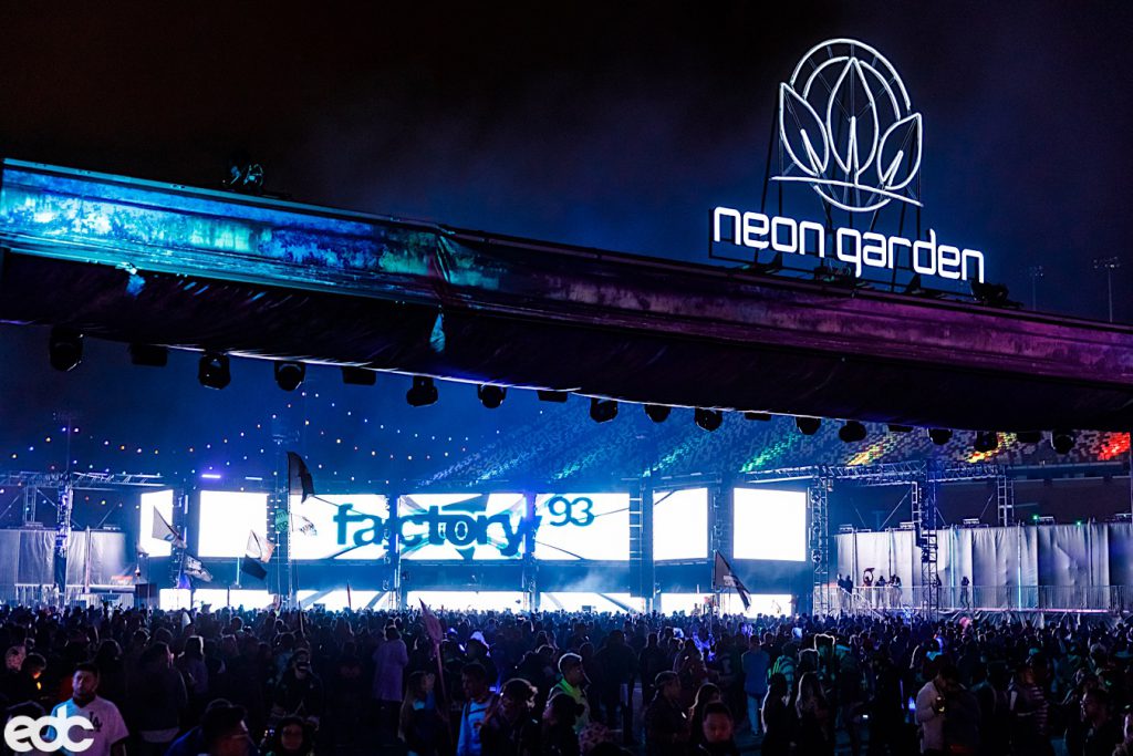 Neon Garden stage with a large crowd and factory 93 on the big screen