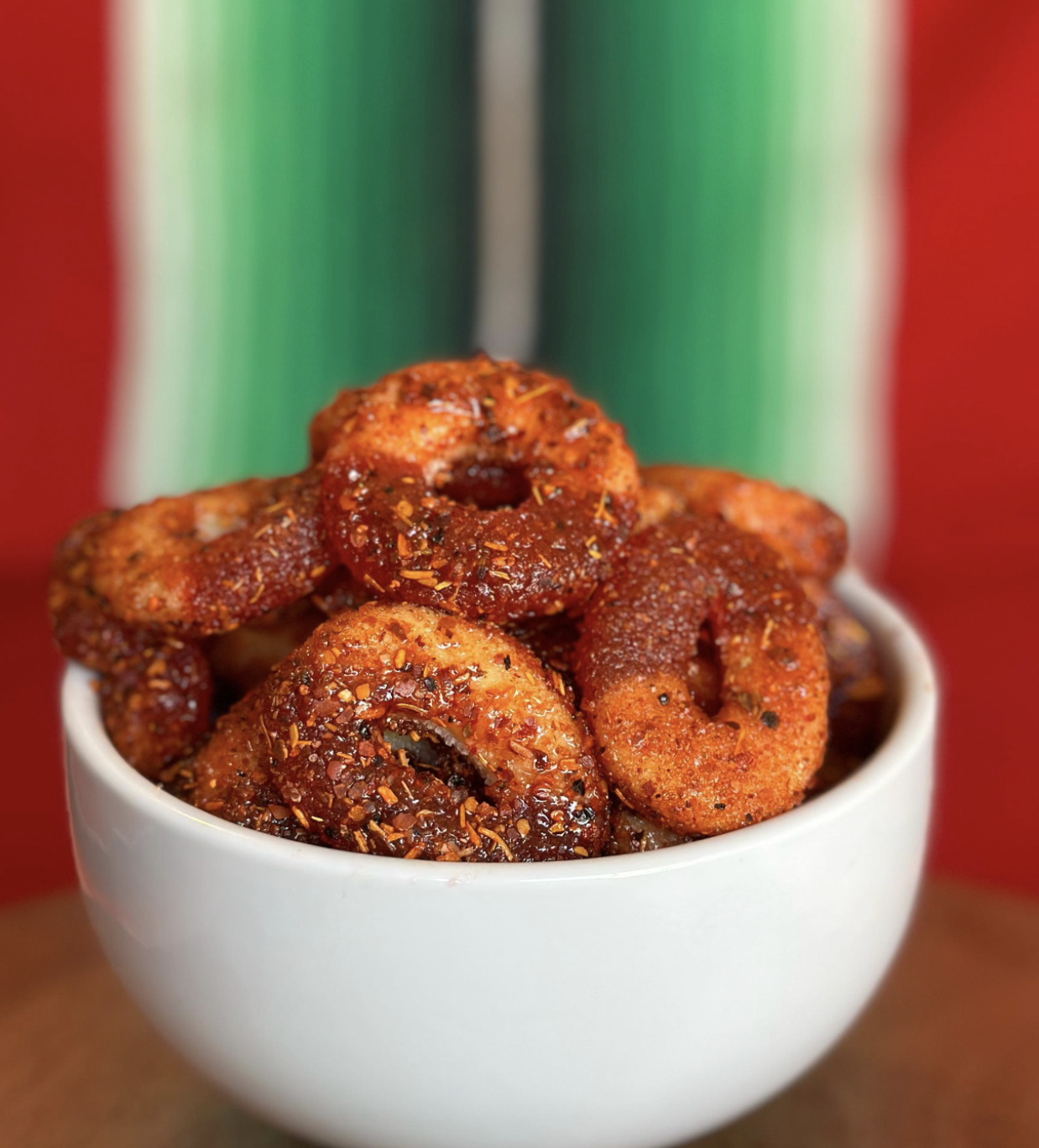 Sweet and spicy peach ring gummies coated in chili powder
