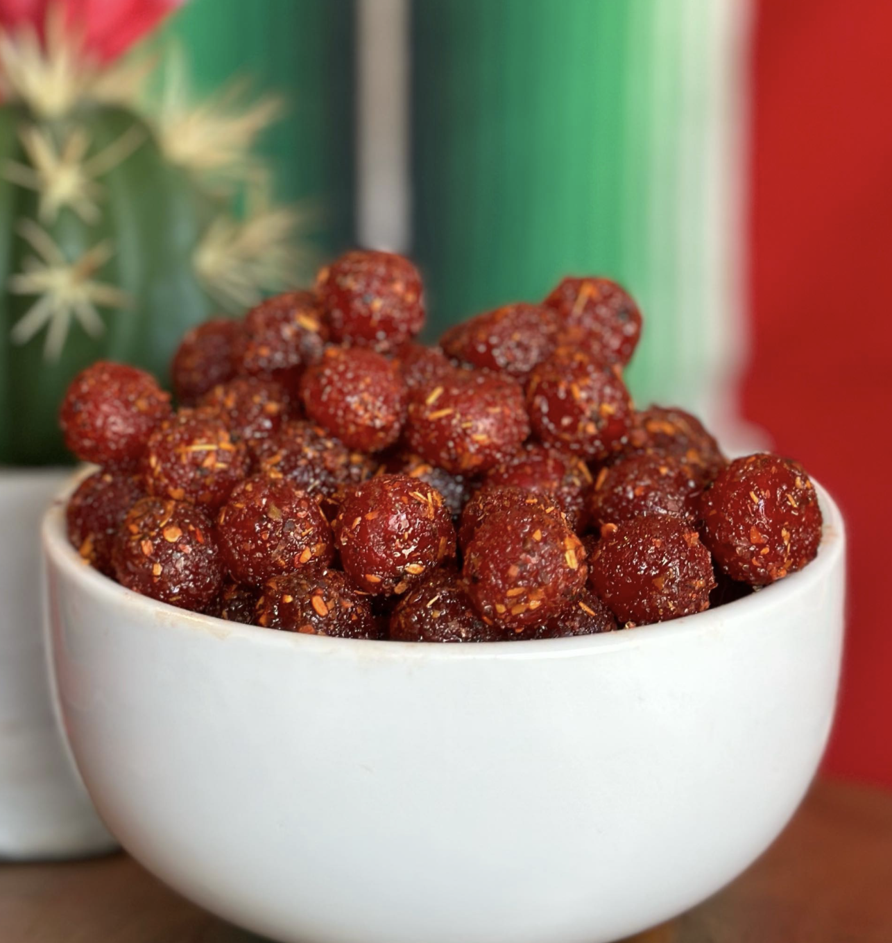 Red sour cherry gummies with a spicy-sweet chili coating